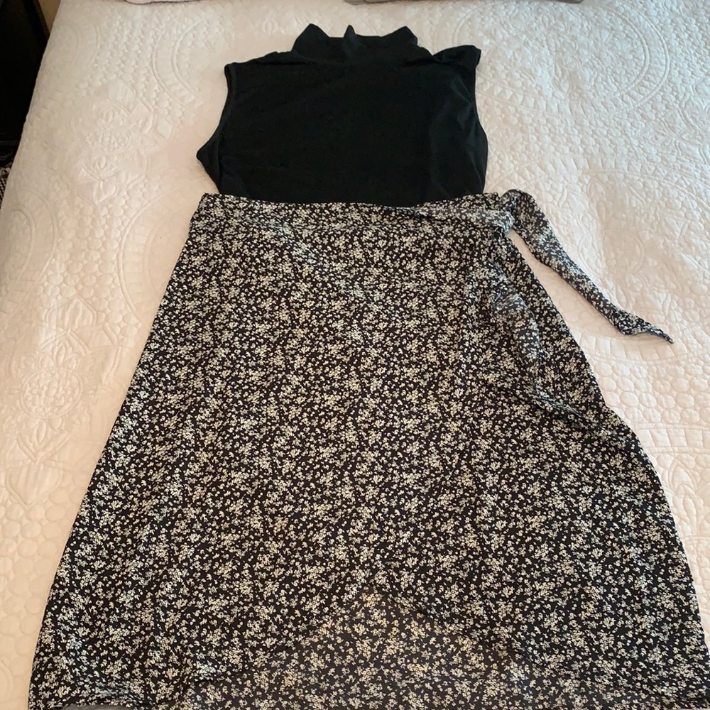 SHEIN Curve black floral wrap skirt with sleeveless mock turtleneck.